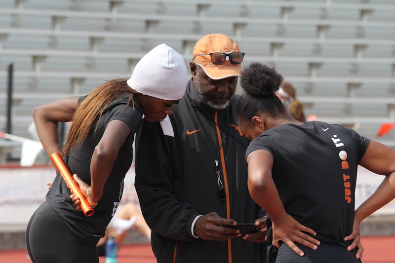 Rhasidat Adeleke's coach, Edrick Floréal, with the Dublin sprinter during training at the Mike A Myers Stadium in the University of Texas. Photograph: Darragh Bambrick