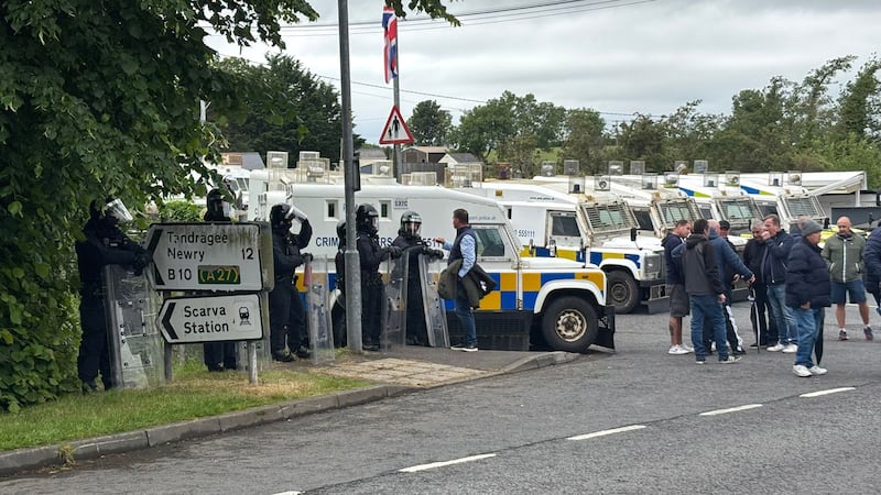 A large number of armoured vans with riot police  separate counter-protesters from the pro-Palestinian march at Scarva, Co Down. Photograph: Niall Carson/PA Wire