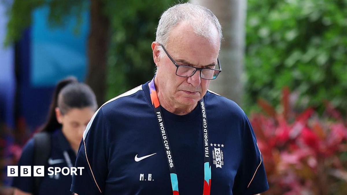 Close-up of Marcelo Bielsa in a Uruguay training shirt, looking downwards