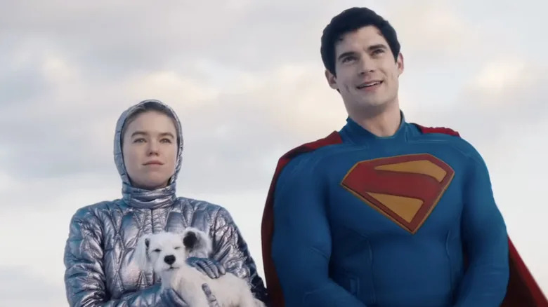 Milly Alcock as Kara Zor-El holding a young Krypto next to David Corenswet as Superman in Supergirl (2026)