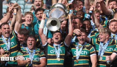 Fraser Dingwall and Fin Smith lift the Prem Rugby trophy following Northampton's win over Exeter