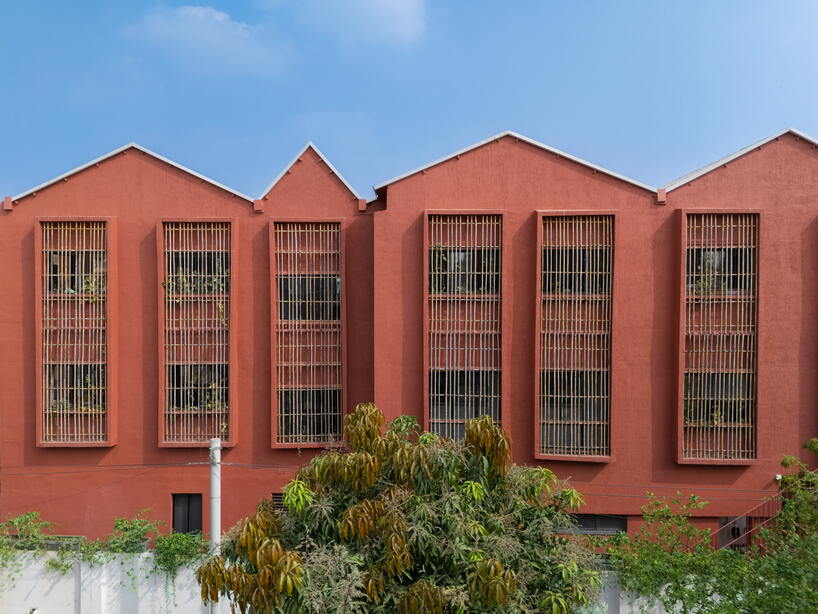 underused house reconfigures into child-centered bright red preschool in india - 2