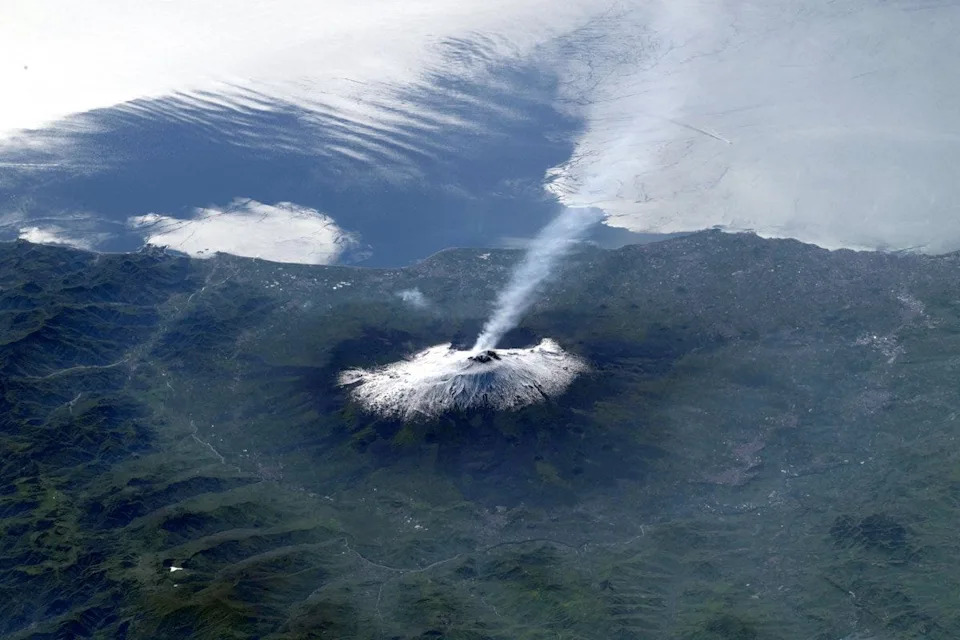 Sophie Adenot, a French astronaut with the European Space Agency, recently captured photos of Mount Etna and Mount Vesuvius from the International Space Station as the outpost flew over Italy.