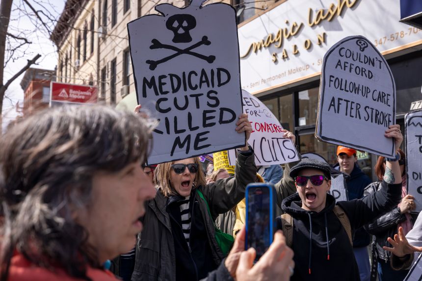 People protest against the cutting of federal healthcare spending, in the Brooklyn borough of New York, on March 22, 2025.