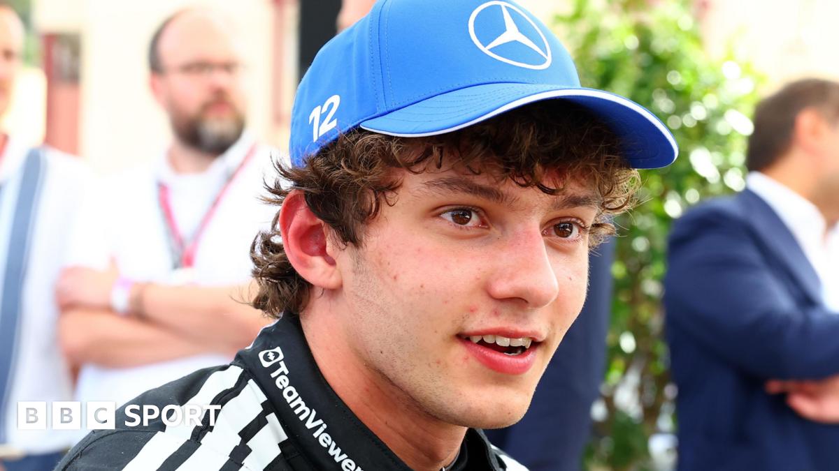 Kimi Antonelli, wearing a Mercedes cap, smiles after taking pole position for the Monaco Grand Prix