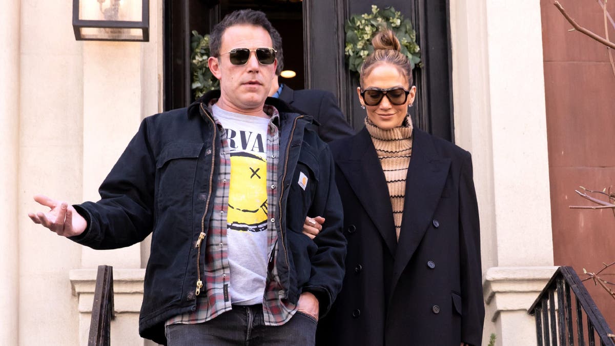 Ben Affleck and Jennifer Lopez walking together in New York City.