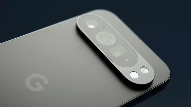 A closeup of the backside of a black Google Pixel smartphone, the photo is focusing on the device's camera system