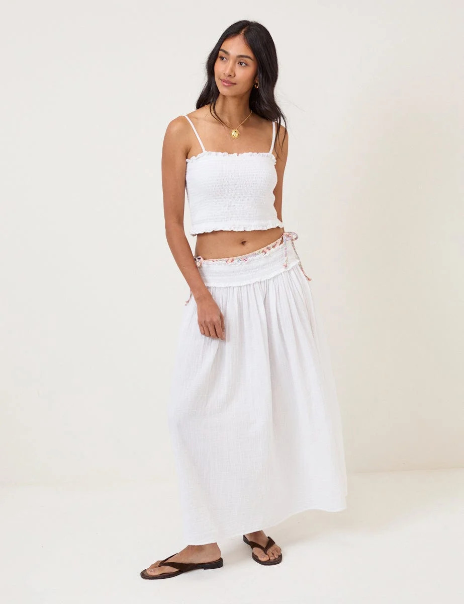 Too hot for denim? A white midi skirt is a summer staple