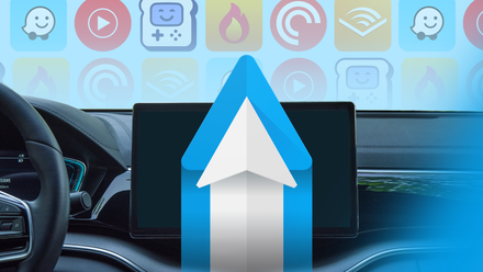Car dashboard with a central display showing the Android Auto logo, with colorful app icons.