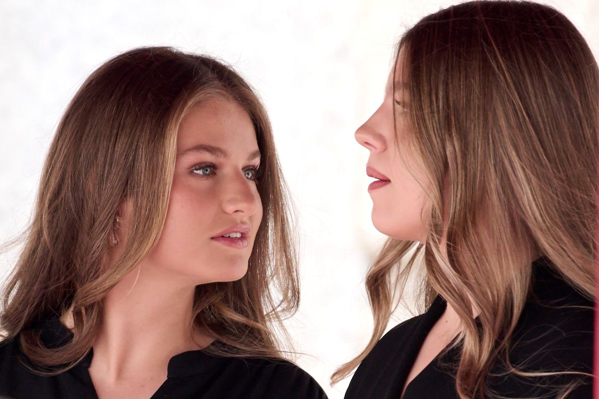 A candid moment between the royal sisters, noted for their close and affectionate relationship.