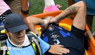 Manuel Ugarte leaves the pitch after being injured during the 2026 World Cup Group H football match between Uruguay and Spain