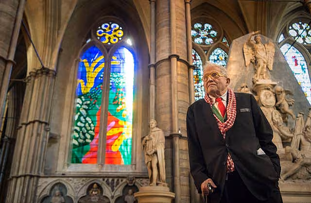David Hockey standing next to his The Queen’s Window design