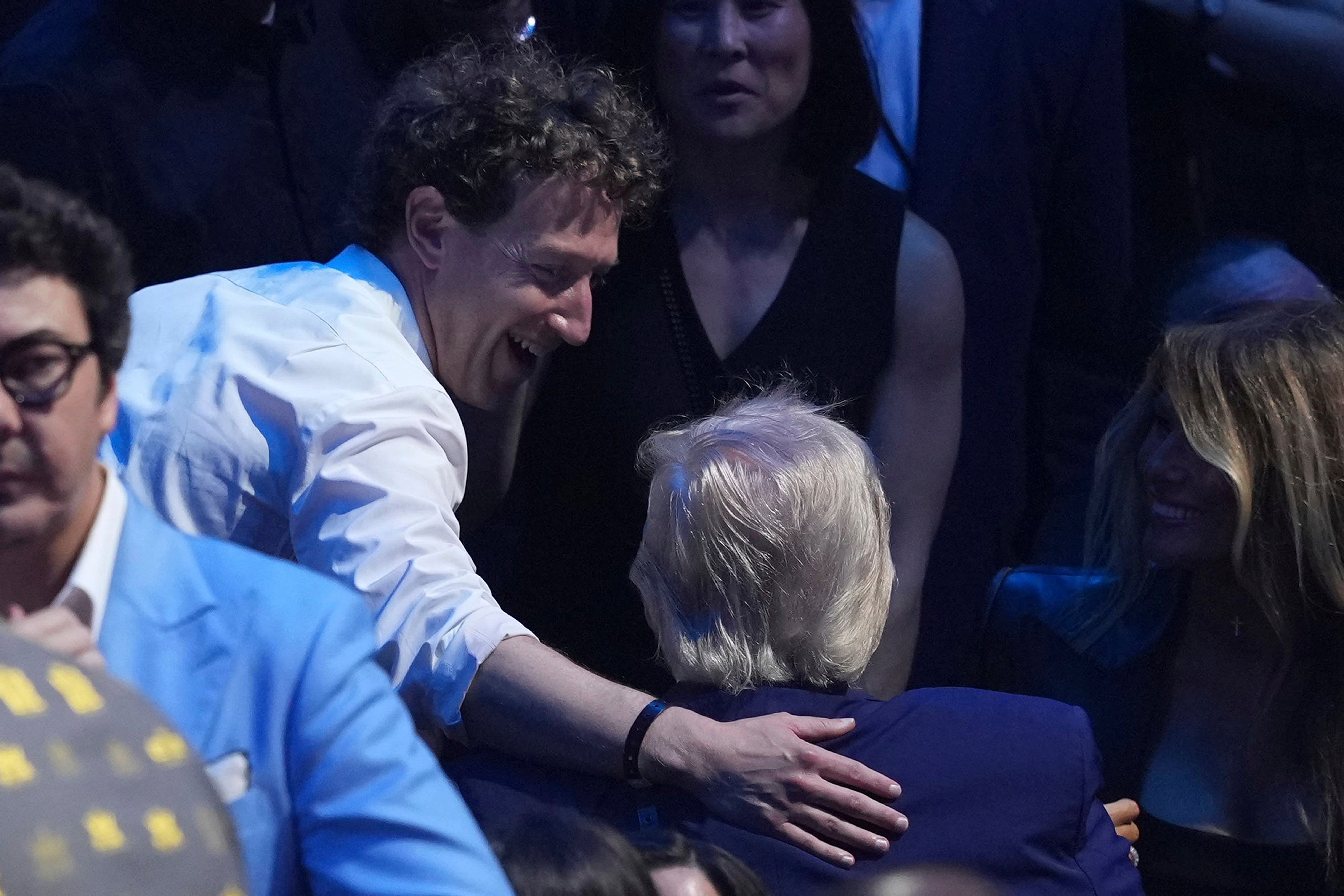 Meta chief executive Mark Zuckerberg was seen patting the president on the back as they greeted each other ringside