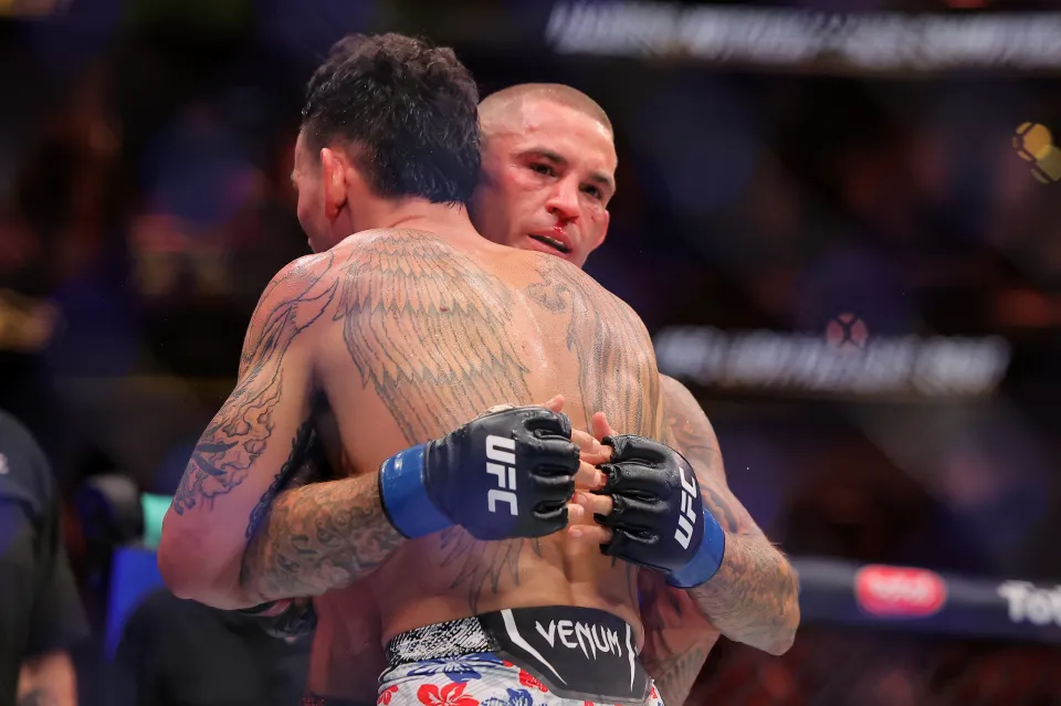 NEW ORLEANS, LOUISIANA - JULY 19: Dustin Poirier of the United States and Max Holloway of the United States embrace after their lightweight bout during UFC 318: Holloway vs Poirier 3 at the Smoothie King Center on July 19, 2025 in New Orleans, Louisiana. (Photo by Jonathan Bachman/Getty Images)