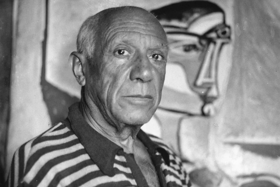 Picasso, who died in 1973, pictured with one of his paintings at his home in Cannes (Getty)