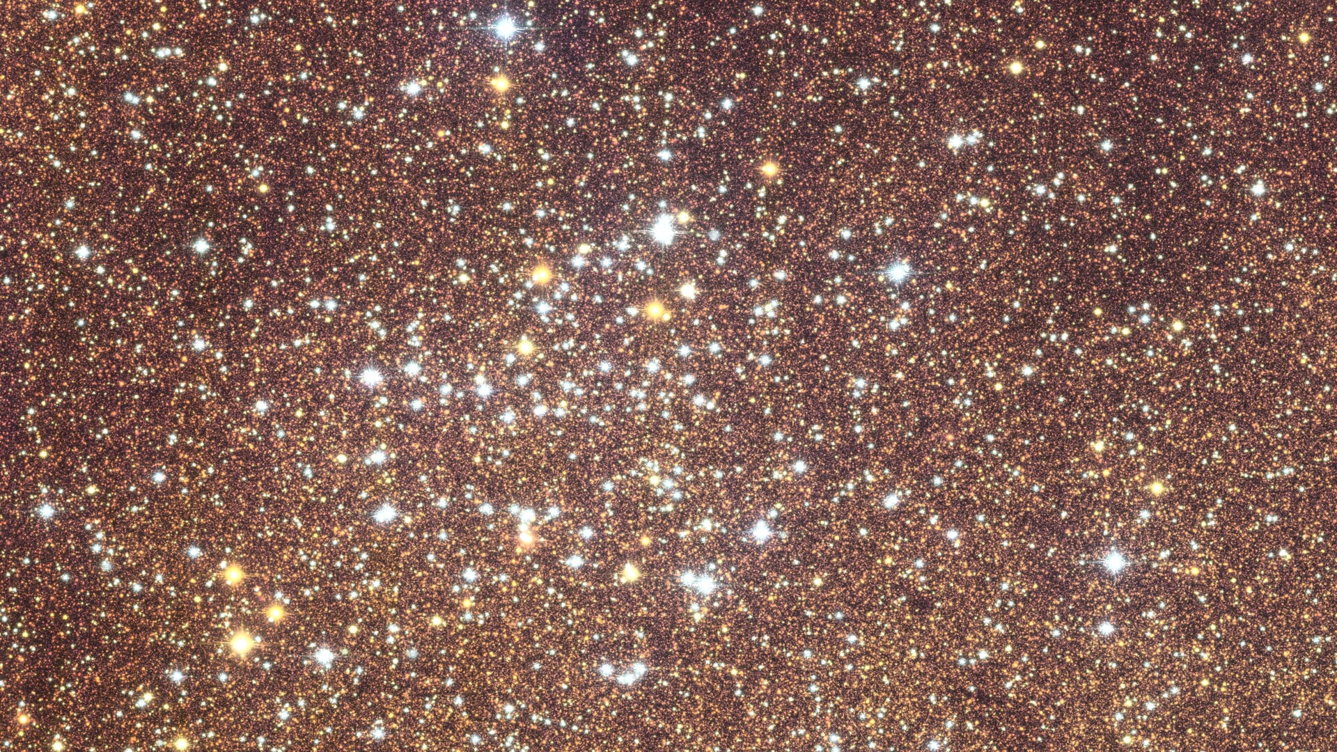 a tight view of a very detailed photograph of the bulge in the center of the Milky Way galaxy showing a star cluster