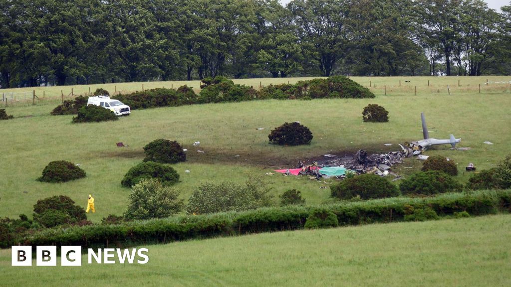 Royal Navy helicopter crash investigations continue in Devon - BBC