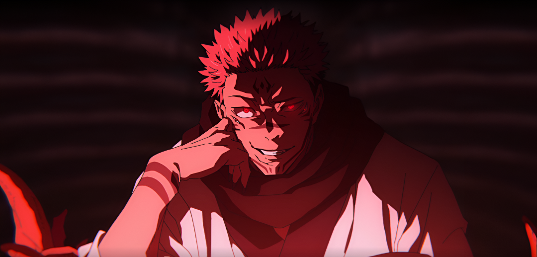 A pink haired man grins maniacally as he looks at the camera in Jujutsu Kaisen