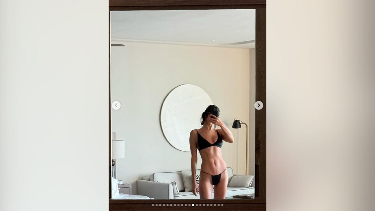 Irina Shayk in a black bikini in a mirror selfie she posted on Instagram.