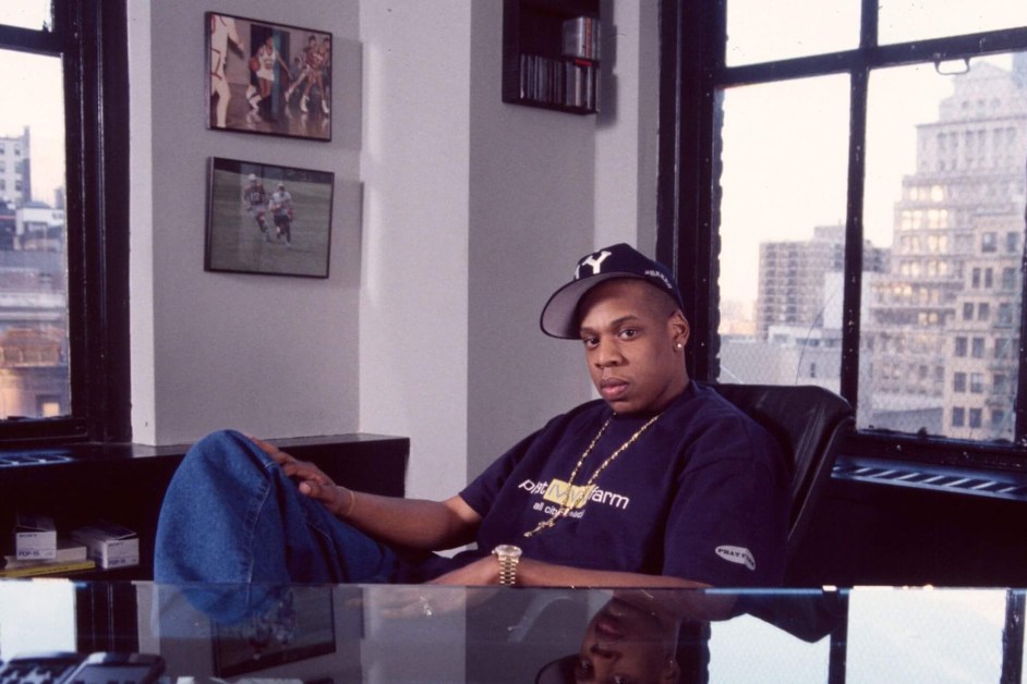 Portrait of American rapper and music executive Jay Z as he sits behind a desk in his lower Manhattan office, New York, New York, April 1996. (Photo by Nitro/Getty Images)