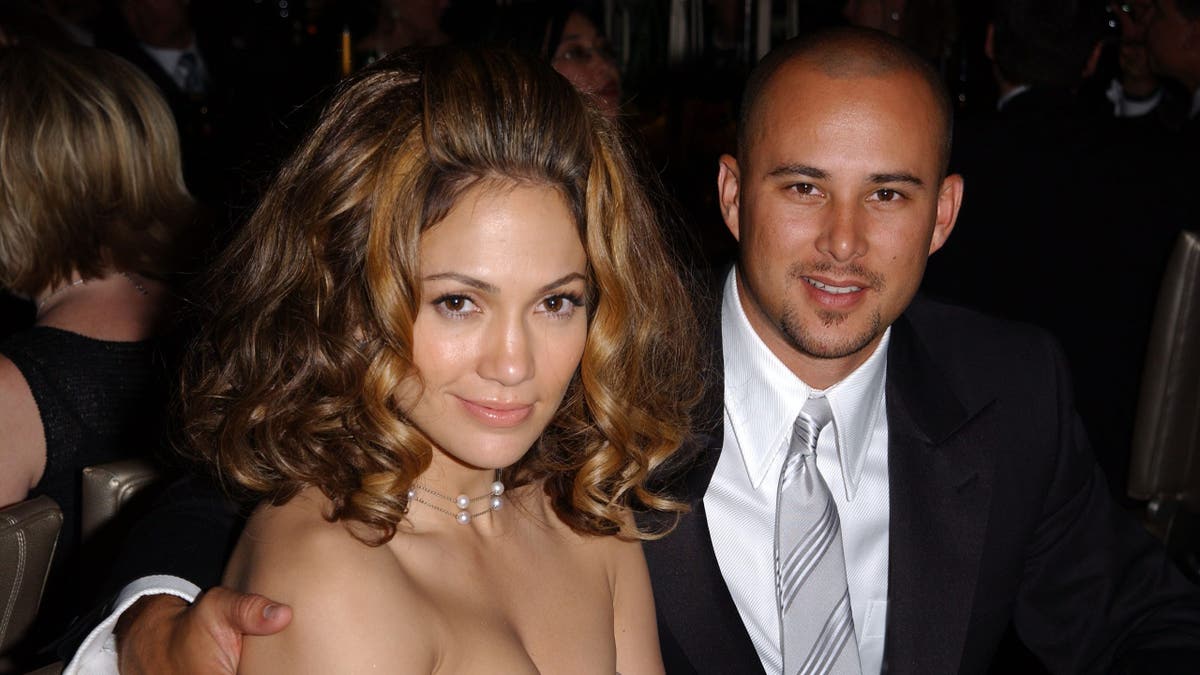 Jennifer Lopez and husband Chris Judd standing together at the Governors Ball.
