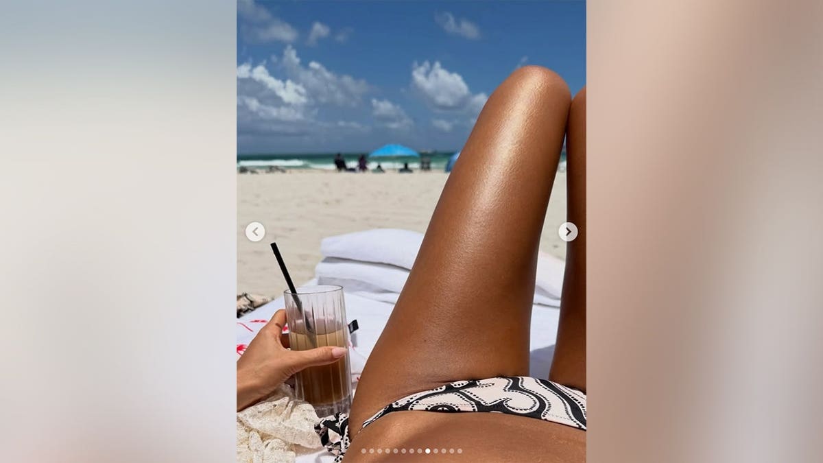 Jessica Alba's stomach and legs as she lays on the beach in an Instagram post.