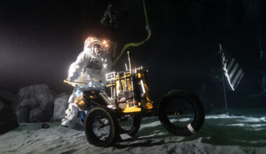 Wearing a spacesuit, Scott Wray conducts an underwater test in lunar night-like lighting at the bottom of the Neutral Buoyancy Laboratory pool.