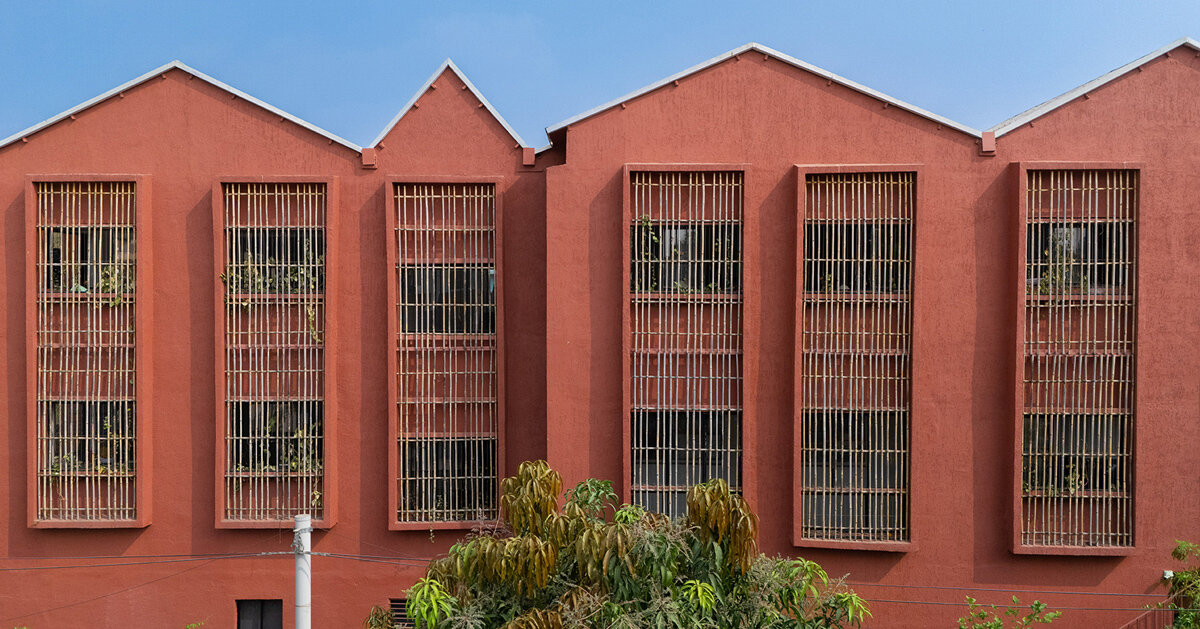 underused house reconfigures into bright red preschool in india