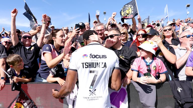 Exeter Chiefs' Christ Tshiunza celebrates with the fans after his side's Prem Rugby semi-final win at Bath