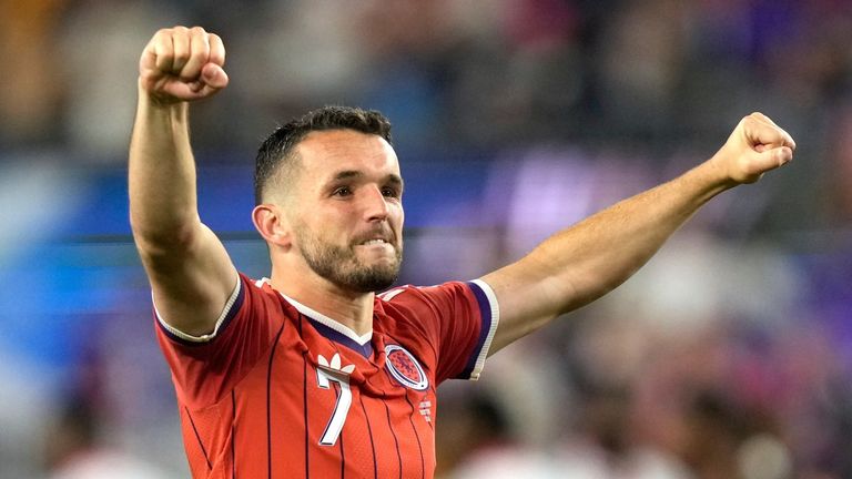 Scotland's John McGinn celebrates at full-time after his goal won the World Cup opener against Haiti
