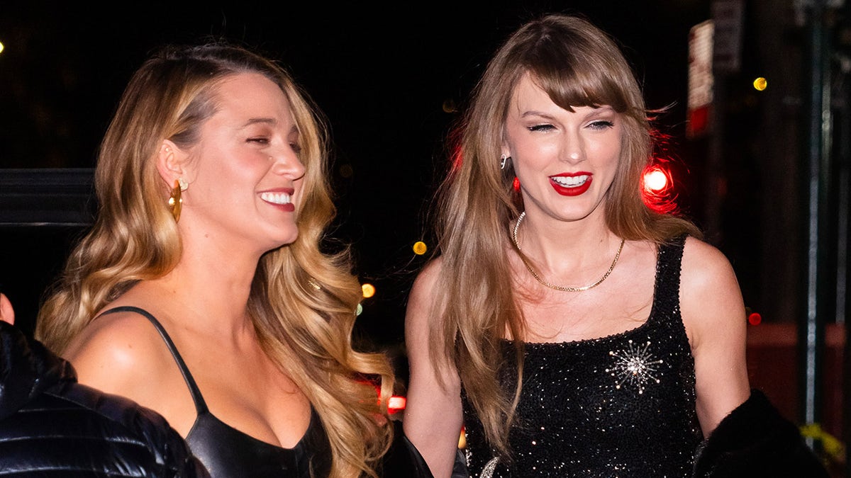 Blake Lively smiling and walking alongside Taylor Swift during dinner.