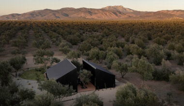 two corrugated metal volumes frame serentha cabin in mexico