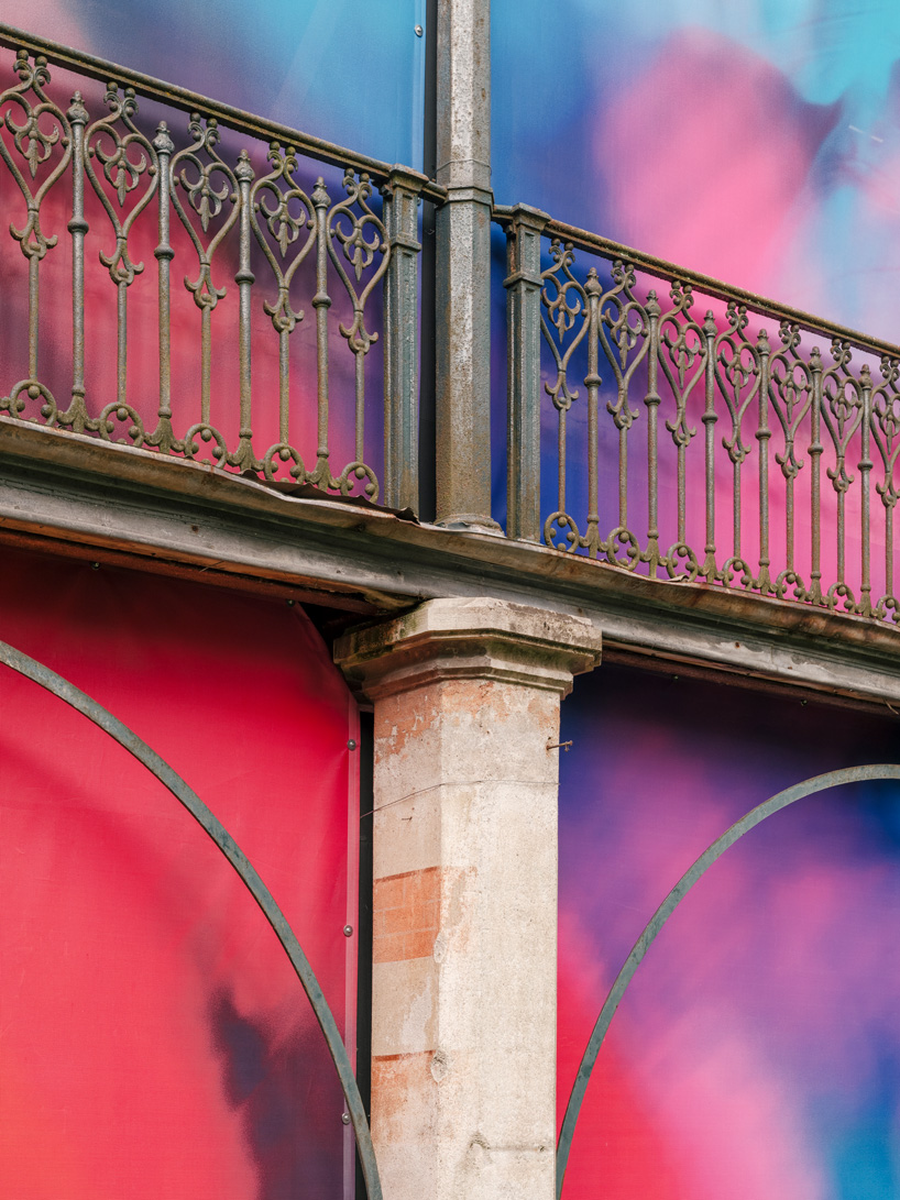 colorful printed textile installation reimagines historic laundry building facade in switzerland - 4
