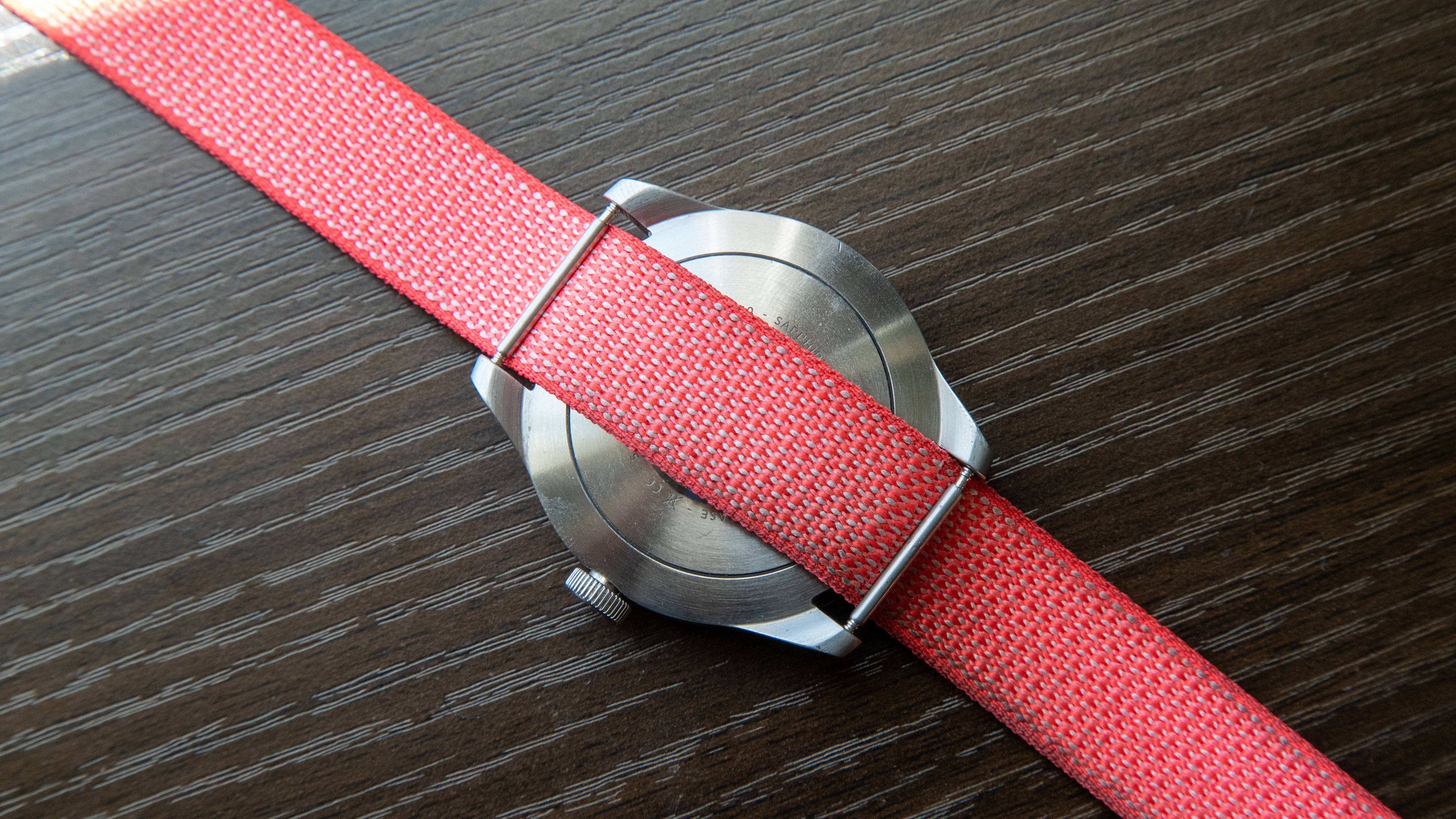 Google Fitbit Air band with an analogue watch