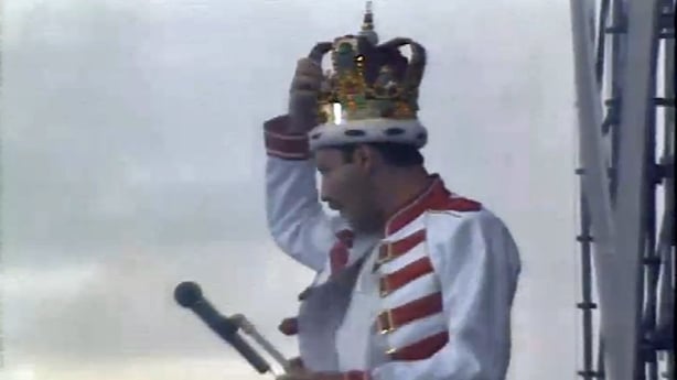 Freddie Mercury wearing a crown on stage