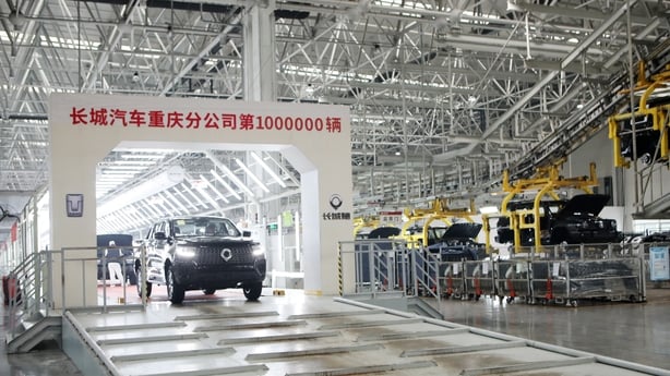 Newly-finished cars rolling off the production line at the Great Wall Motors' factory in China