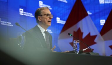 Bank of Canada holds rates, sees economic growth in H2