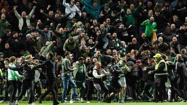 Celtic fans celebrate on the pitch after Kelechi Iheanacho scores a penalty to make it 3-2 during a William Hill Premiership match between Motherwell and Celtic at Fir Park, on May 13, 2026, in Motherwell, Scotland.