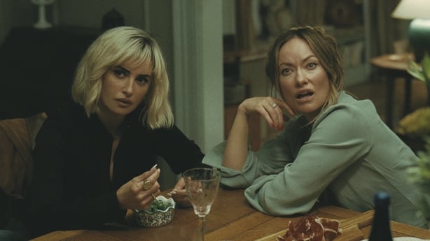 Penélope Cruz as Piña and Olivia Wilde as Angela in The Invite