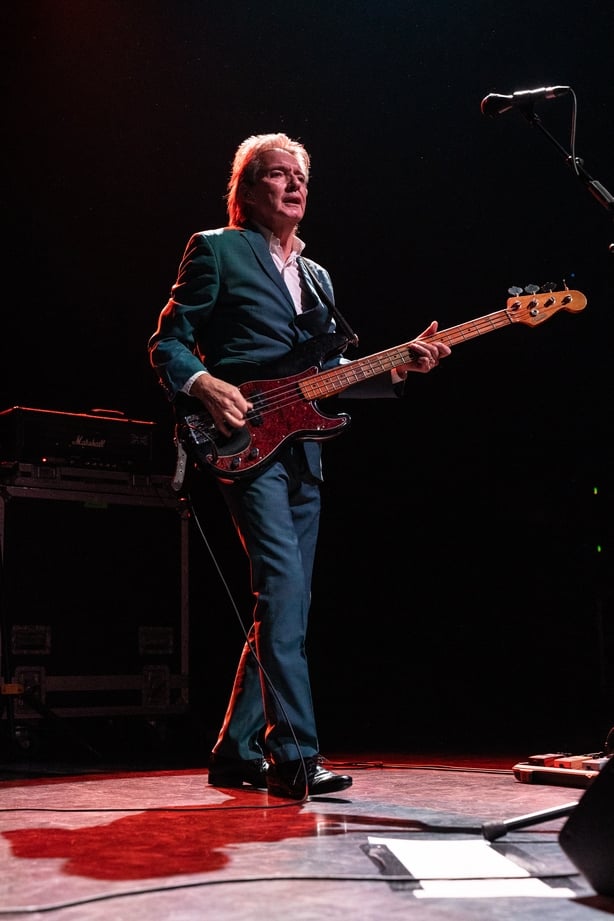 Guitarist from UK band performs on stage