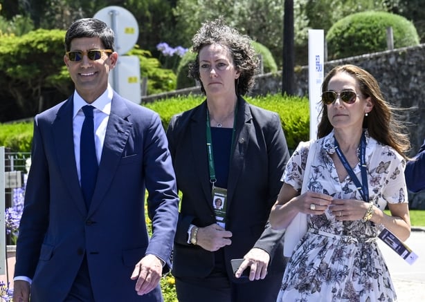 SINTRA, PORTUGAL - JULY 01: Security guards follow Kevin Warsh, Chairman, Board of Governors of the Federal Reserve System, as he arrives accompanied by his wife Jane Lauder to participate in the Policy Panel at the afternoon session in Penha Longa Resort during the last day of the 2026 European Cen