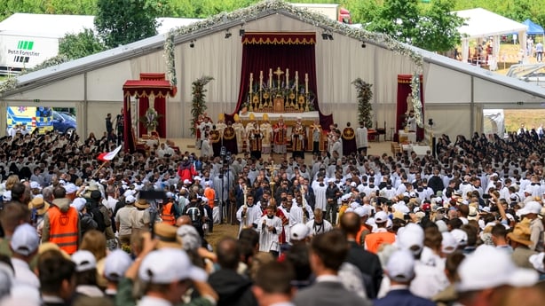 People attend an ordination ceremony in Econe, Switzerland