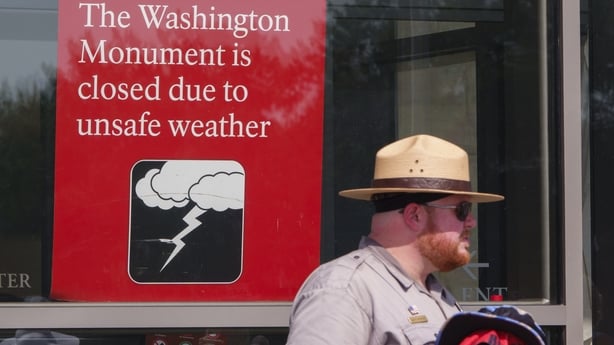 A sign is displayed at the Washington Monument letting visitors know it is closed during a record-setting heat wave