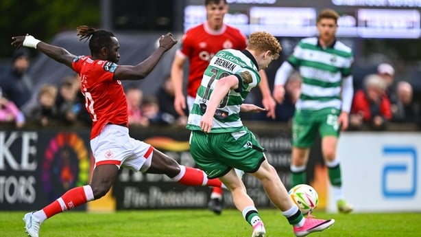 3 July 2026; Adam Brennan of Shamrock Rovers shoots under pressure from Jeannot Esua of Sligo Rovers during the SSE Airtricity Men's Premier Division match between Sligo Rovers and Shamrock Rovers at The Showgrounds in Sligo. Photo by Piaras Ó Mídheach/Sportsfile
