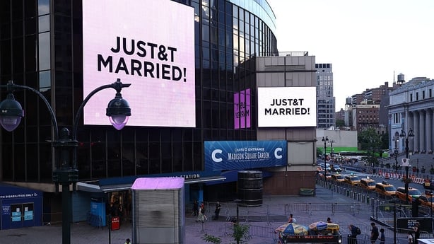 Giant screens show the message