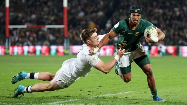 Kurt-Lee Arendse of South Africa runs with the ball whilst under pressure from Tommy Freeman of England during the 2026 Nations Championship match between South Africa and England at Ellis Park Stadium on July 04, 2026 in Johannesburg, South Africa. 