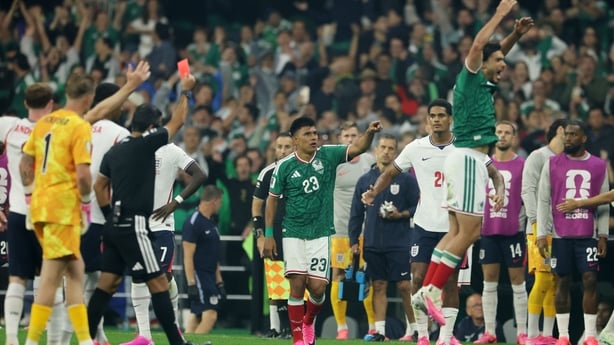 Jarell Quansah #26 of England receives a red card by Referee Alireza Faghani after fouling on Jesus Gallardo #23 of Mexico following the VAR review during the FIFA World Cup 2026 Round of 16 match between Mexico and England at Mexico City Stadium on July 05, 2026 in Mexico City, Mexico.