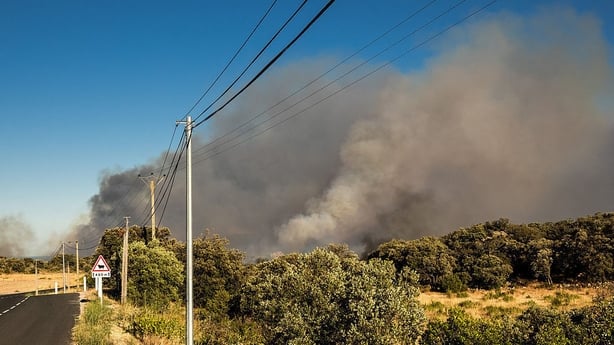 Smoke from a wildfire on the outskirts of the commune of Montalba-Le-Chateau in the Pyrenees-Orientales department, southern France