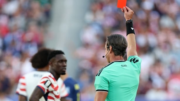 Referee Raphael Claus shows Folarin Balogun #20 of the United States a red card for a foul on Tarik Muharemovic #4 of Bosnia and Herzegovina during the FIFA World Cup 2026 Round of 32 match between USA and Bosnia and Herzegovina at San Francisco Bay Area Stadium on July 01, 2026 in Santa Clara, Cal