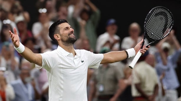 Serbia's Novak Djokovic celebrates beating Canada's Felix Auger-Aliassime during their men's singles quarter-final tennis match on the ninth day of the 2026 Wimbledon Championships at The All England Lawn Tennis and Croquet Club in Wimbledon, southwest London, on July 7, 2026. (Photo by Henry NICHOL